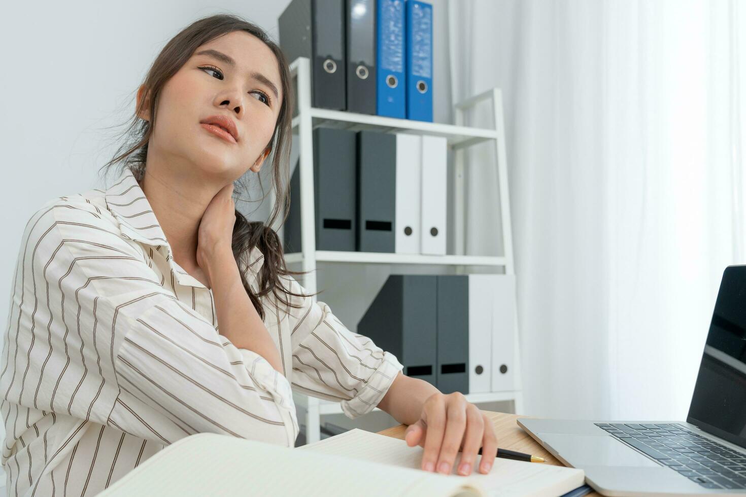 office syndromes, woman massaging neck pain due to work and using a computer, digital composite of a focused spine of neck pain and shoulder pain symptoms , injuries, health care, medical, myositis photo