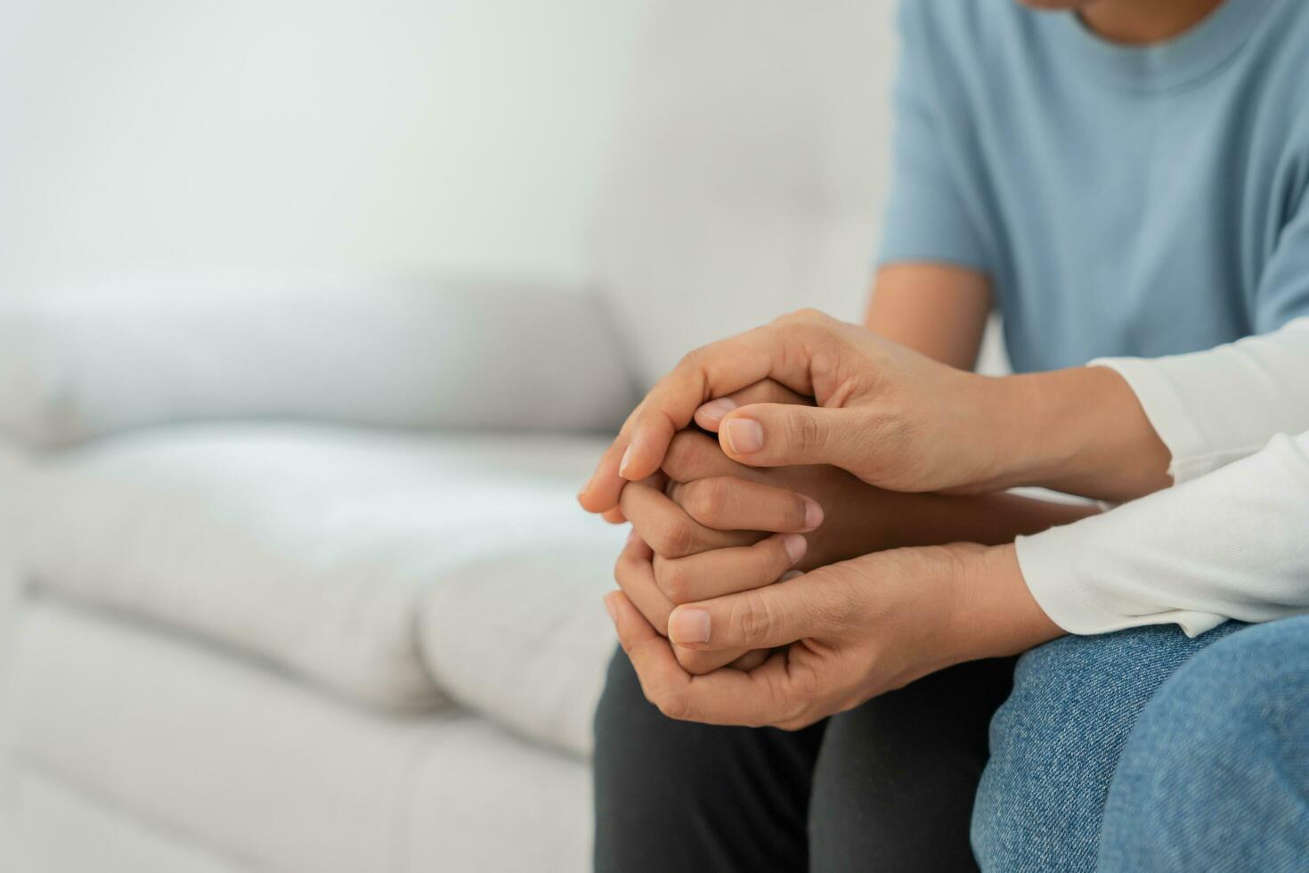 problem in family. mother holding hand encourages, feel stressed from the parents quarrel. child is have mental problem. quarrels, violence, depression, suicide, discouragement, social problem photo