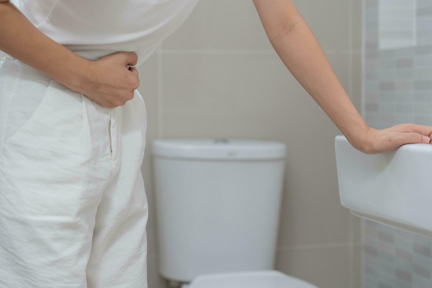 Constipation and diarrhea in bathroom. Hurt man touch belly  stomach ache painful. colon inflammation problem, toxic food, abdominal pain, abdomen, constipated in toilet, stomachache, Hygiene photo