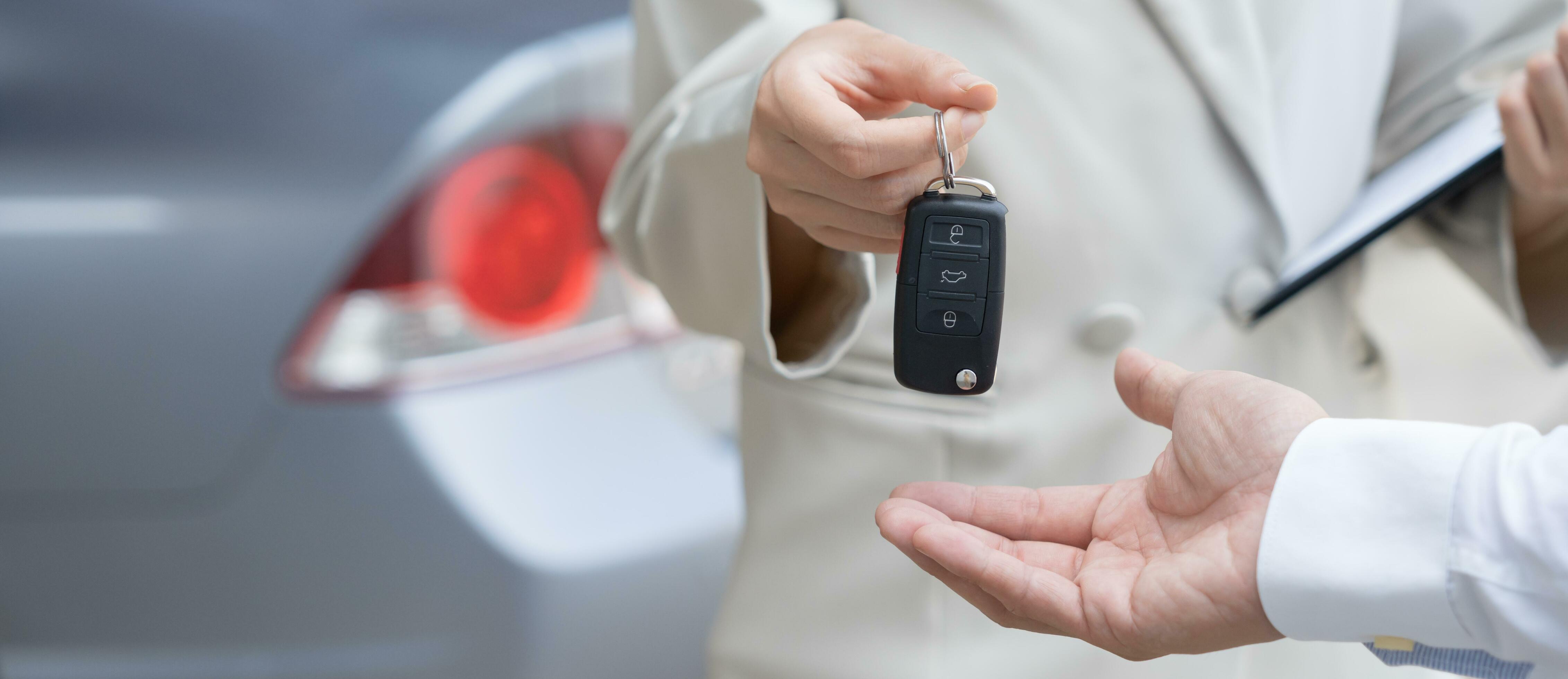 lease, rental car, sell, buy. Dealership manager send car keys to the