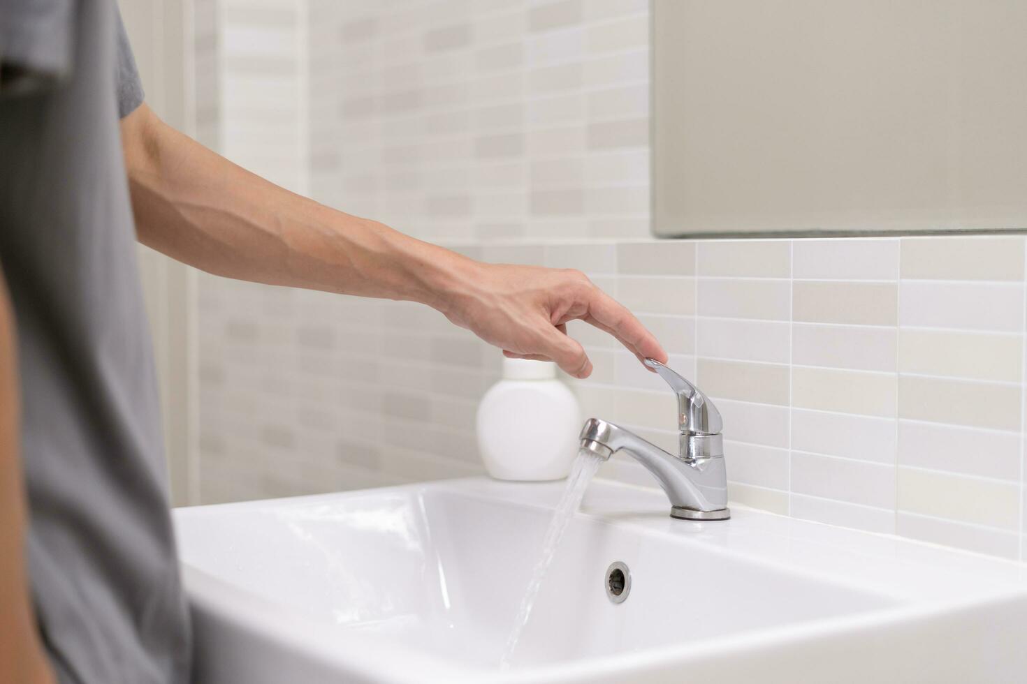 Save water. Volunteer keeps turning off the running water in the bathroom to protect environment. Greening planet, reduce global warming, Save world, life, future, risk energy, crisis , water day. photo