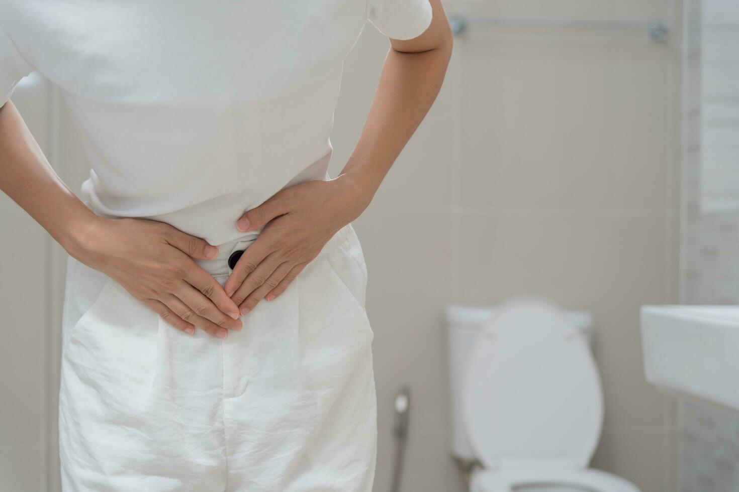 Constipation and diarrhea in bathroom. Hurt woman touch belly stomach