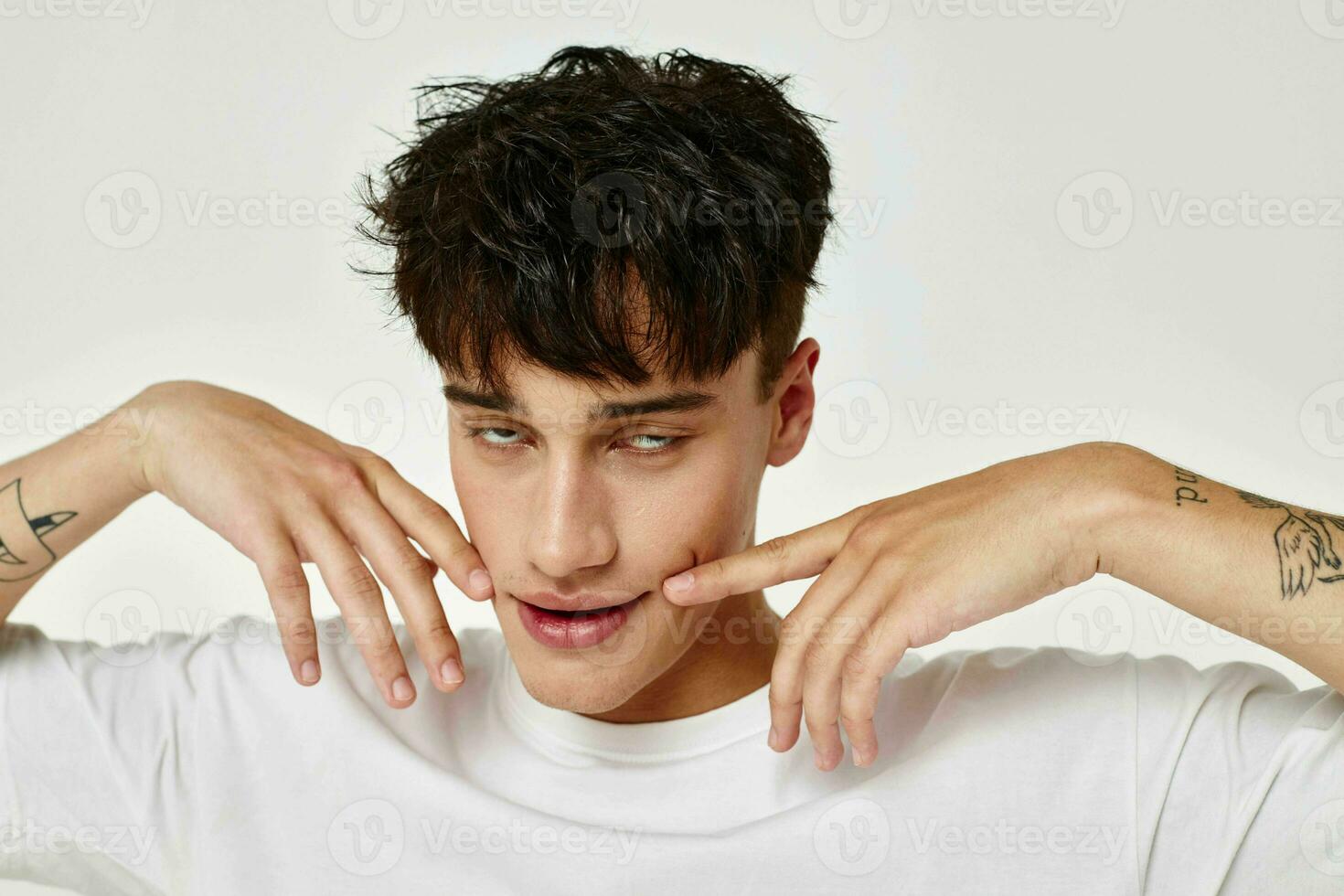handsome guy posing fashion youth style emotions isolated background unaltered photo
