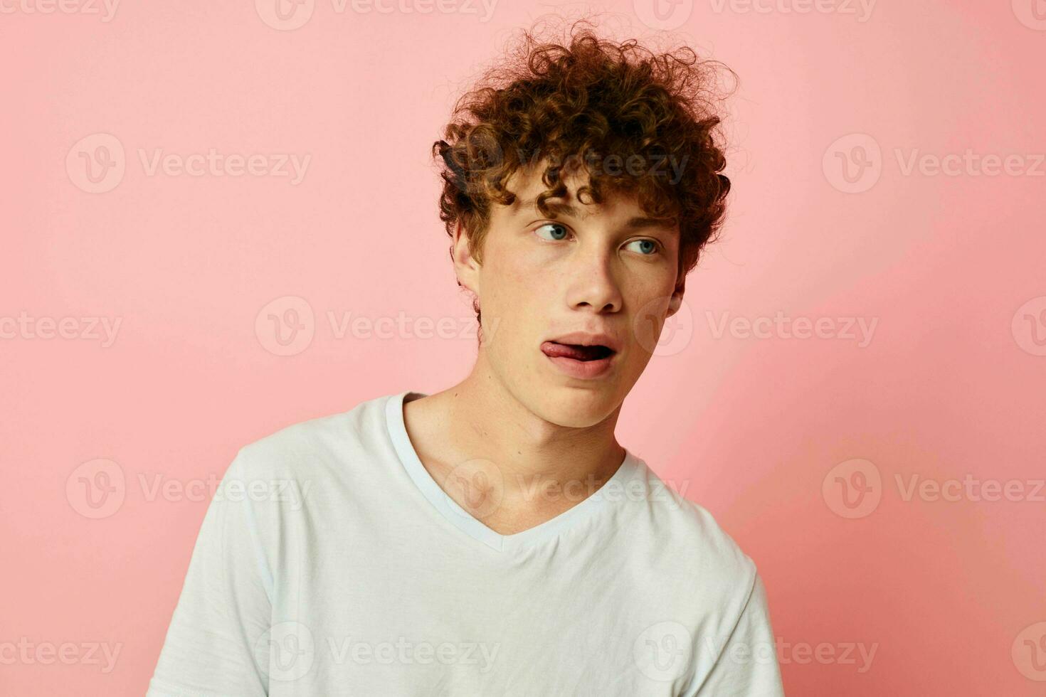 cute red-haired guy posing youth style white t-shirt isolated background unaltered photo