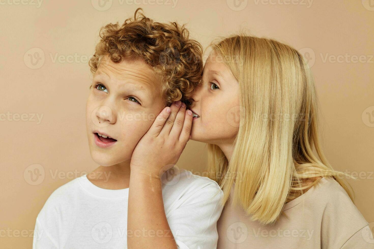 Portrait of cute children fun friendship entertainment beige background photo