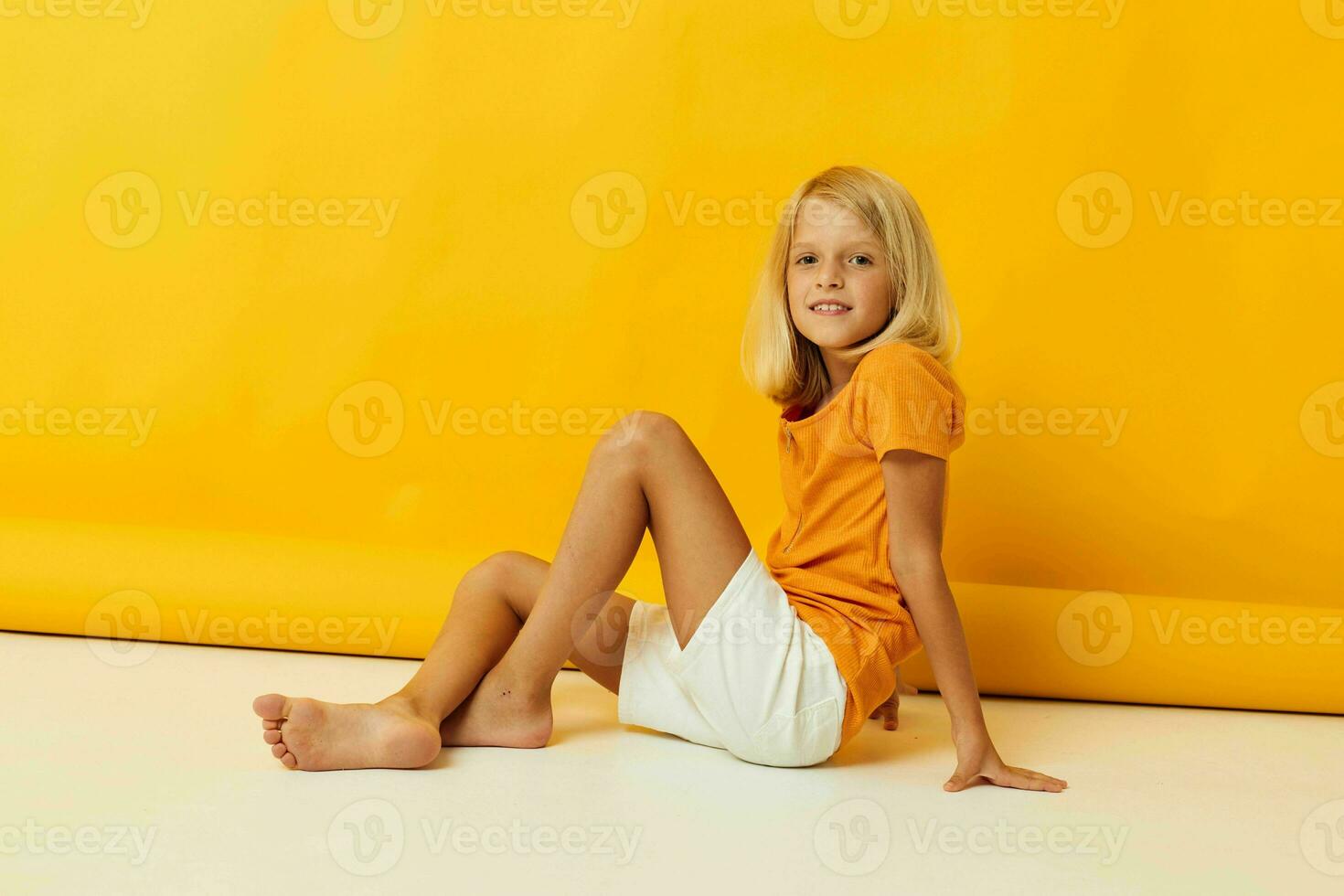 portrait of a little girl smile hand gestures posing casual wear fun isolated background unaltered photo