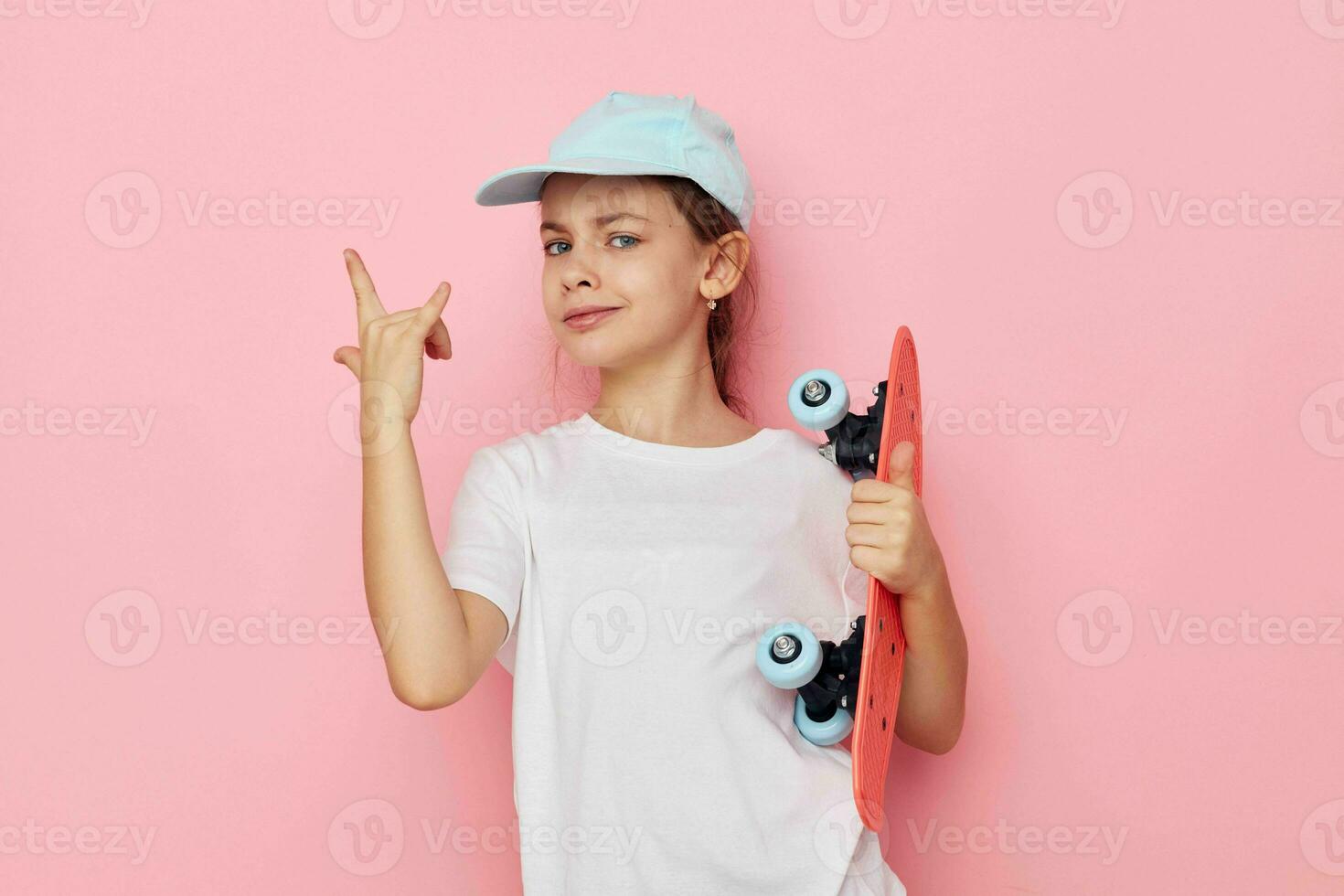 Portrait of happy smiling child girl posing white tshirt emotion isolated background photo