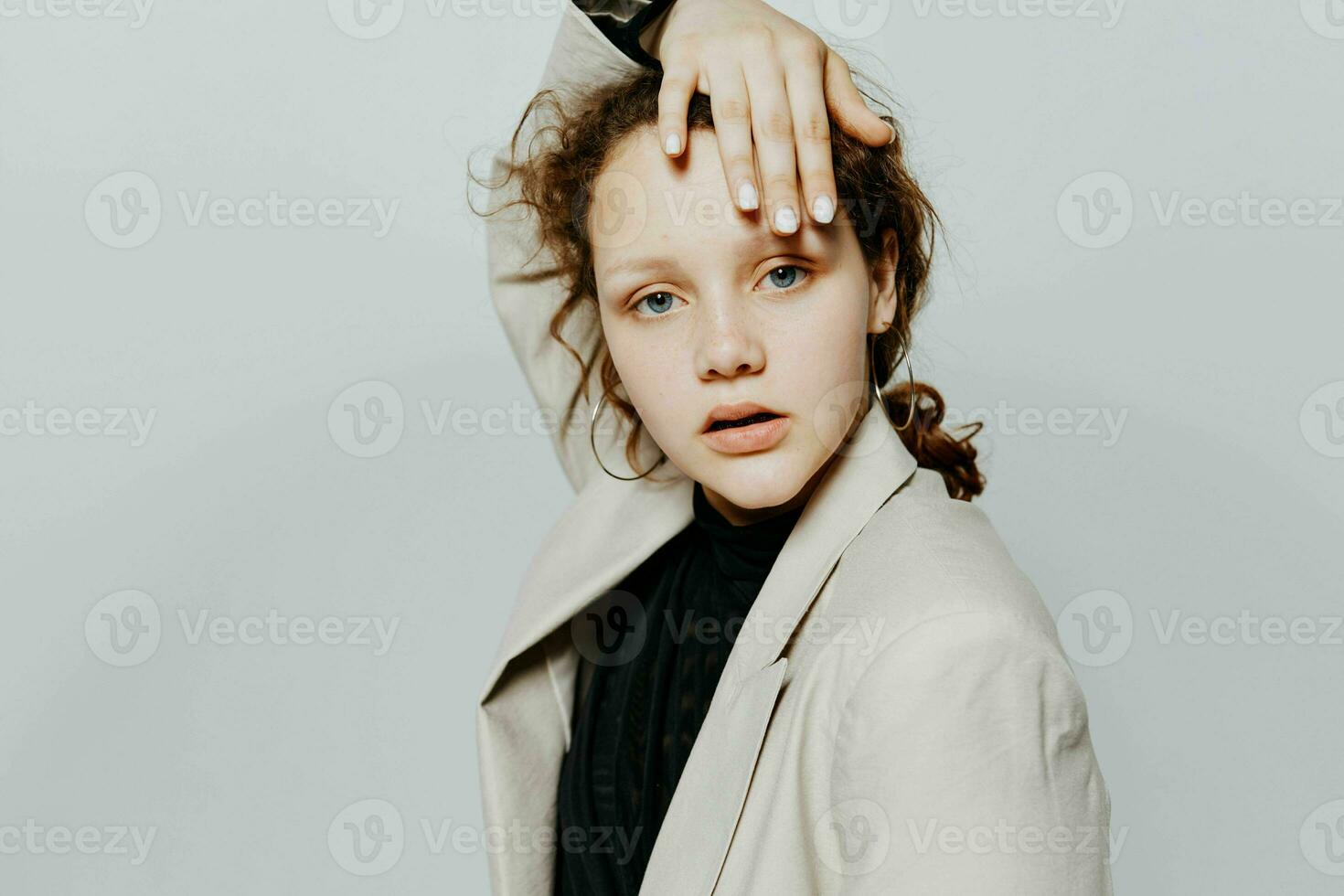 pretty woman In a light classic suit posing emotions Lifestyle unaltered photo