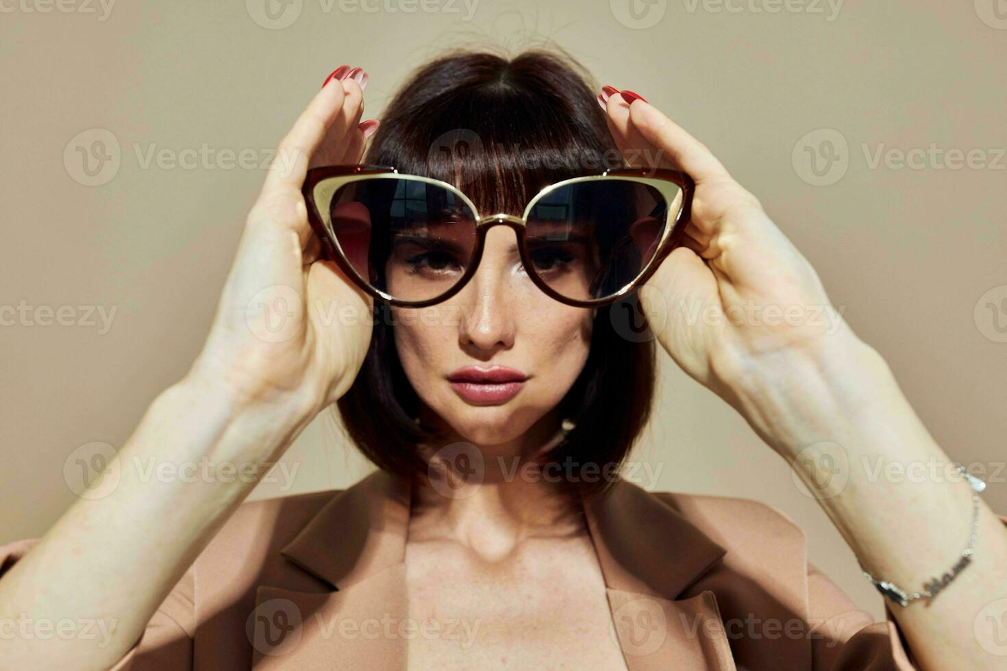 portrait of a woman Charm red nails model luxury sunglasses Lifestyle unaltered photo