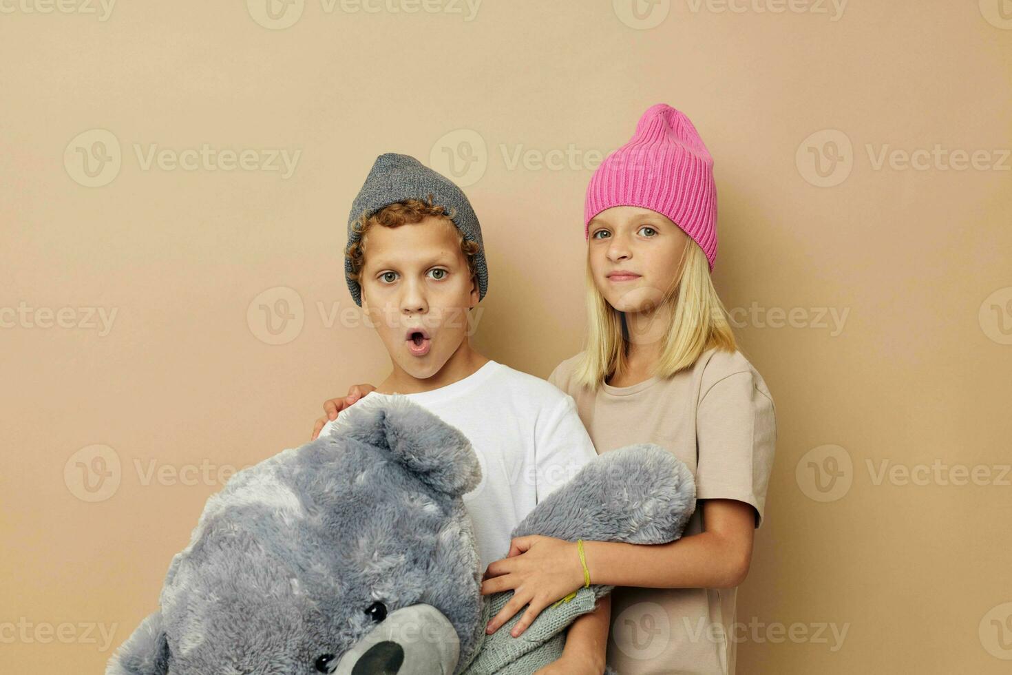 Cute stylish children standing next to posing toy emotions childhood unaltered photo
