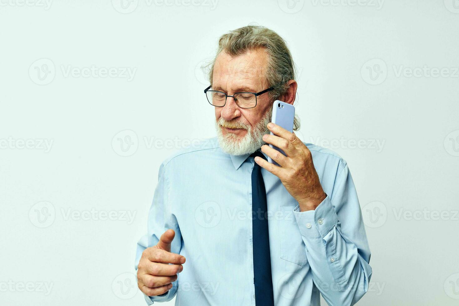 old man in a shirt with a tie talking on the phone cropped view photo