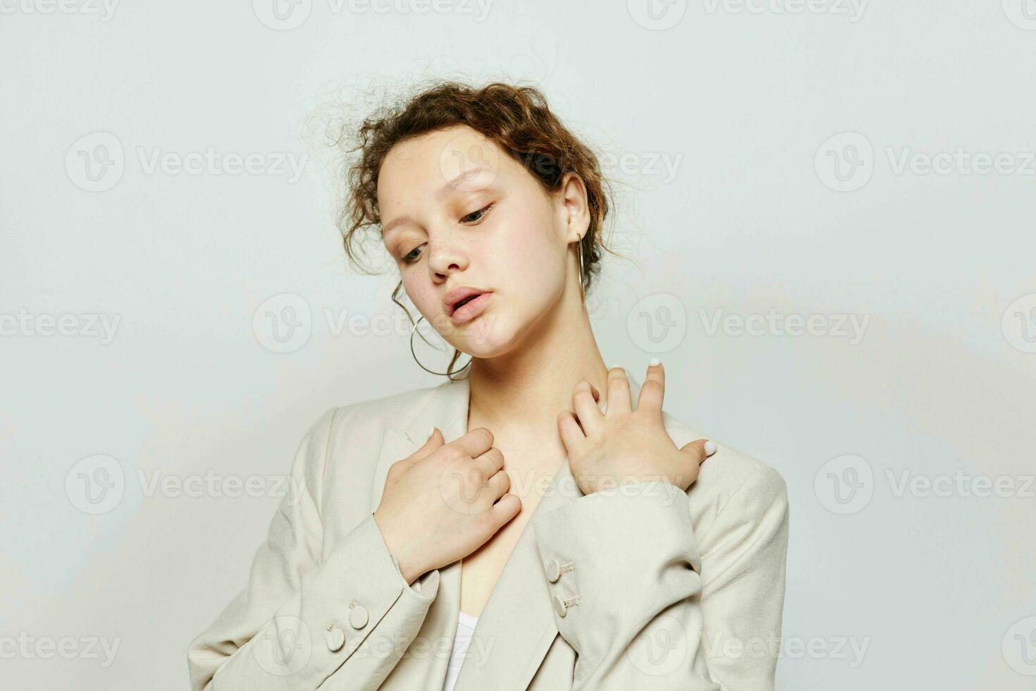 beautiful woman classic suit fashion posing fun light background unaltered photo