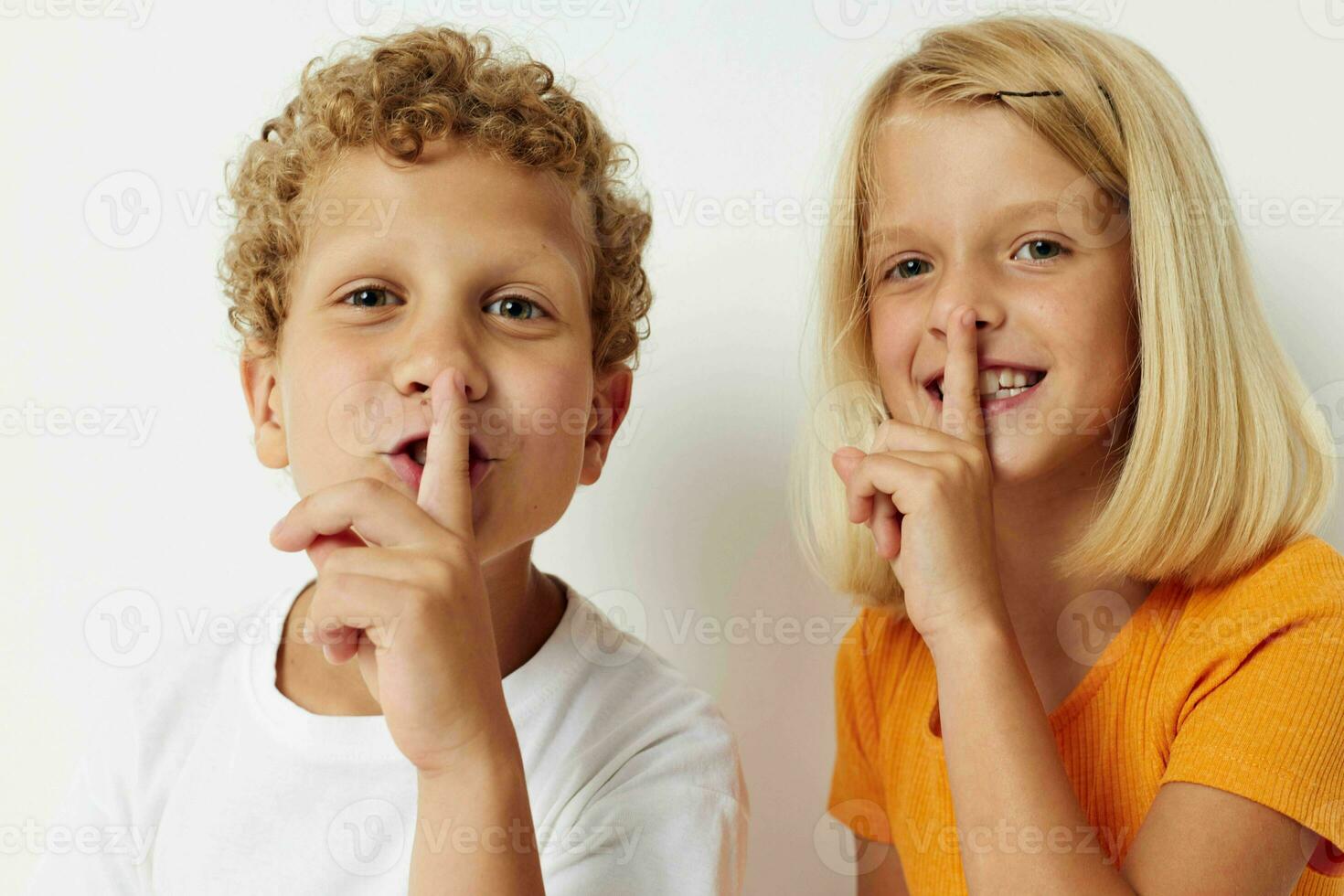 Small children entertainment emotions children studio light background photo
