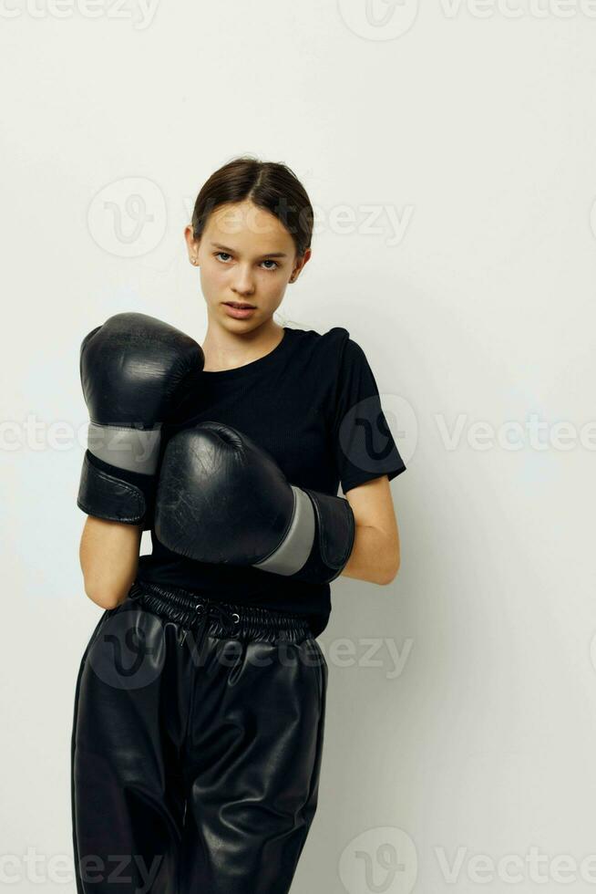 foto bonito niña boxeo negro guantes posando Deportes estilo de vida inalterado