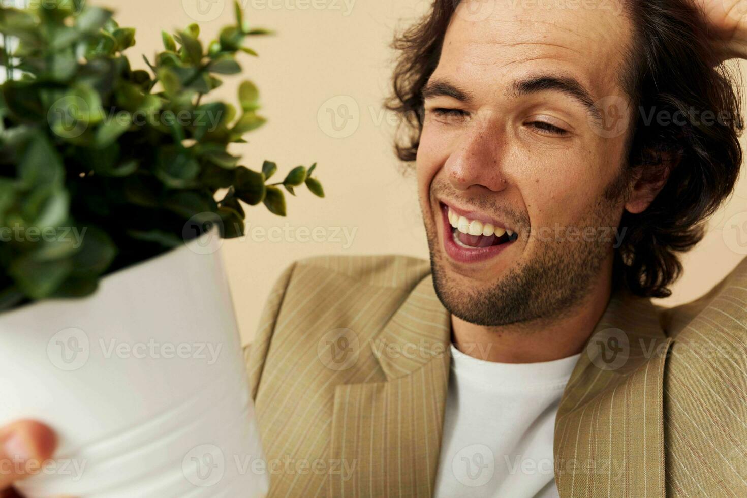 Cheerful man in a suit posing emotions flower pot isolated background photo