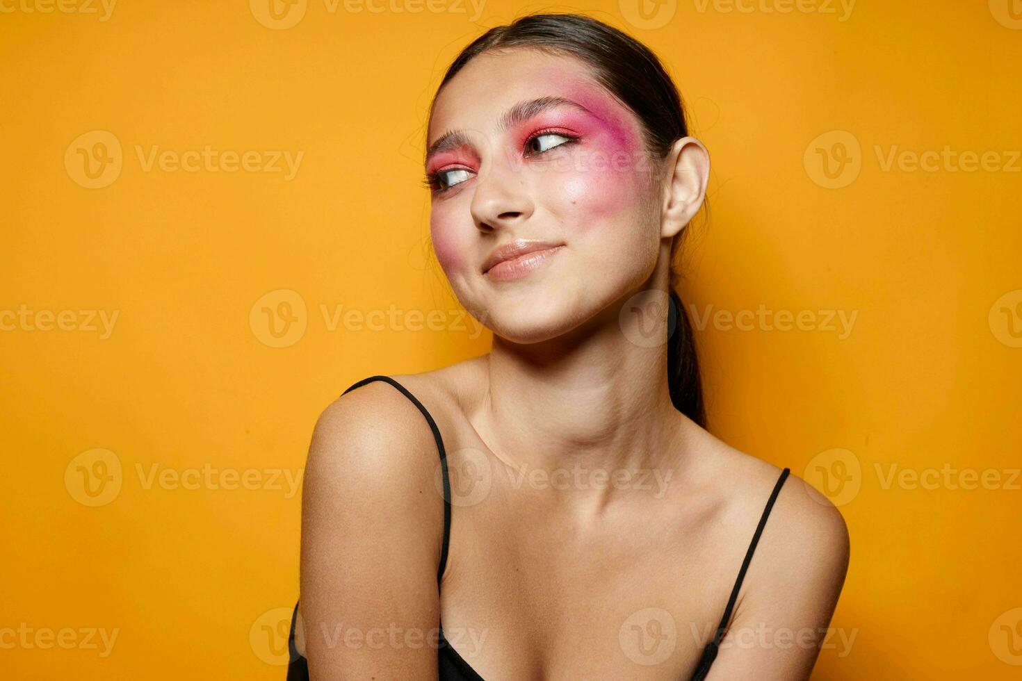 Portrait of beautiful young woman bright makeup posing fashion emotions cropped view unaltered photo