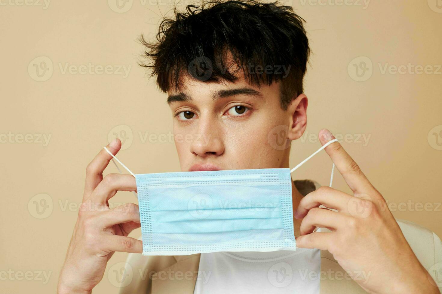 portrait of a young man protective mask in hand in hand modern style Lifestyle unaltered photo