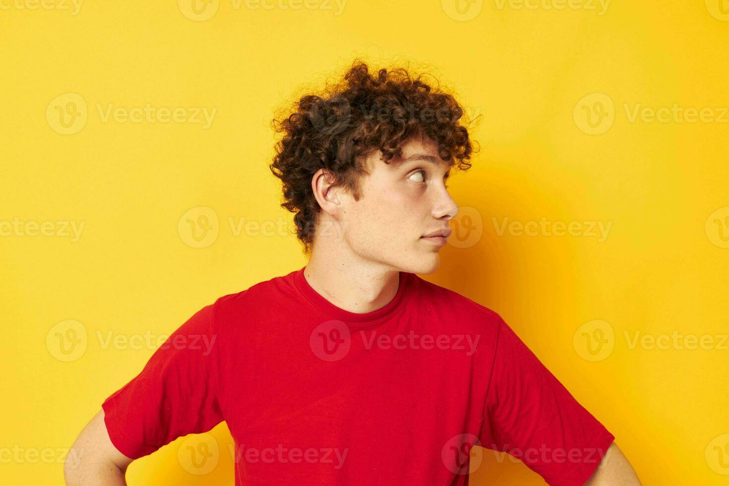 portrait of a young curly man summer style fashion posing isolated background unaltered photo