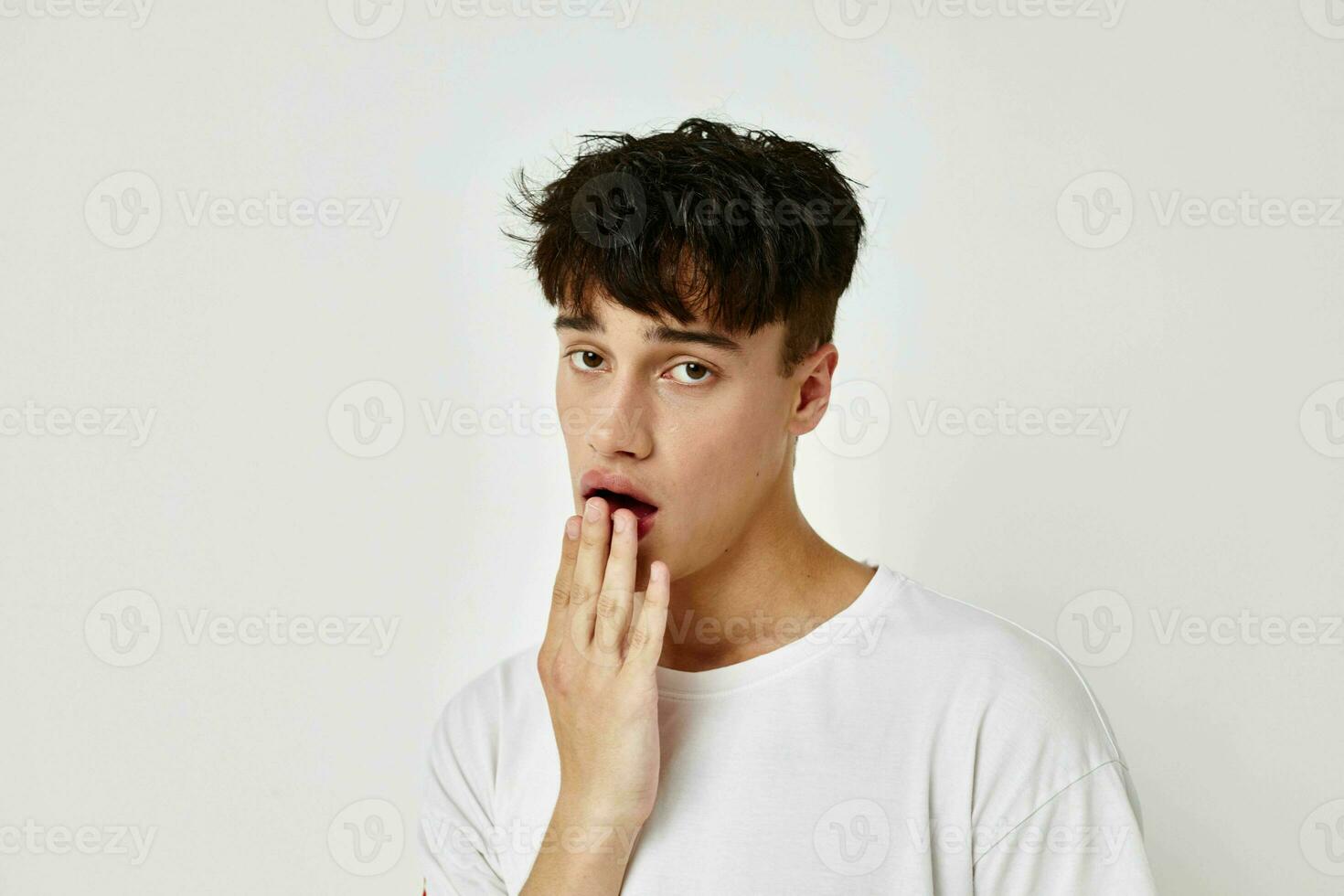 Man posing fashion youth style emotions light background unaltered photo