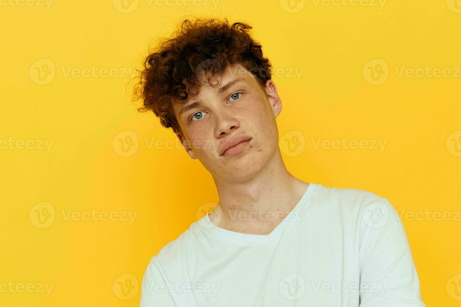 photo of a red-haired guy hand gestures emotions youth style yellow background