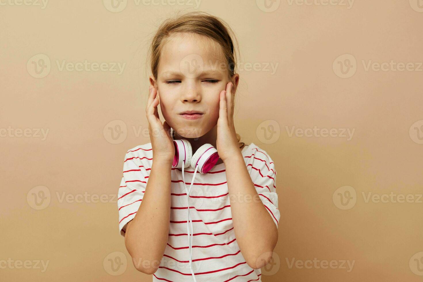 little girl headphones entertainment emotions isolated background photo