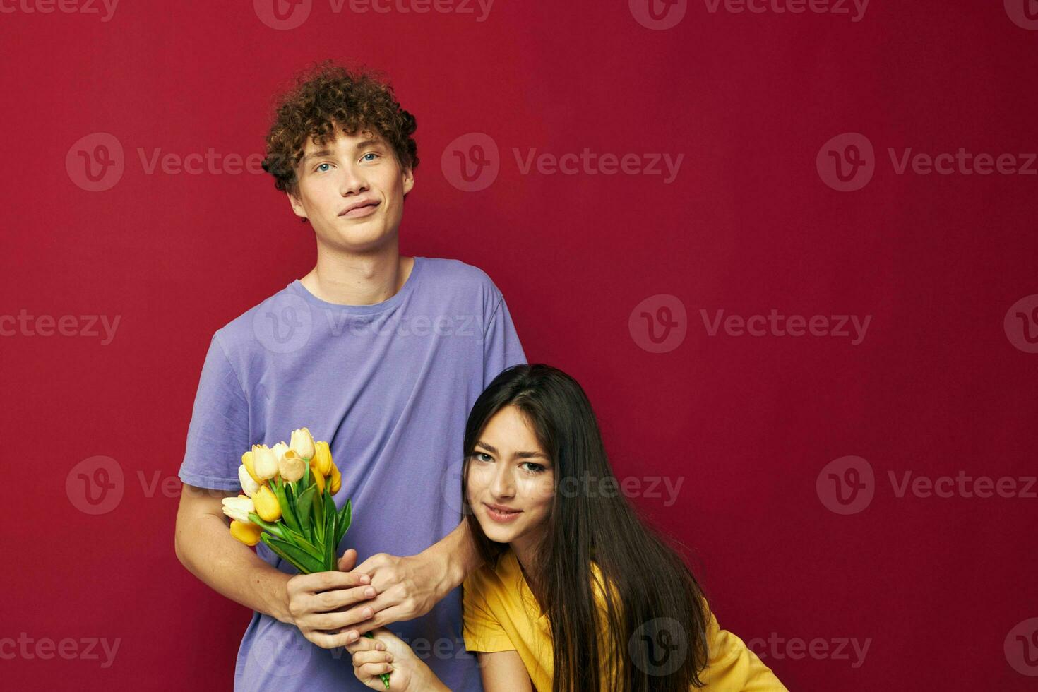 portrait of a man and a woman a bouquet of yellow flowers based friendship yellow background unaltered photo