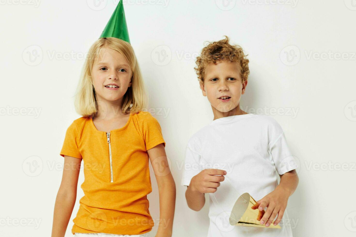 Small children in multicolored caps birthday holiday emotion lifestyle unaltered photo