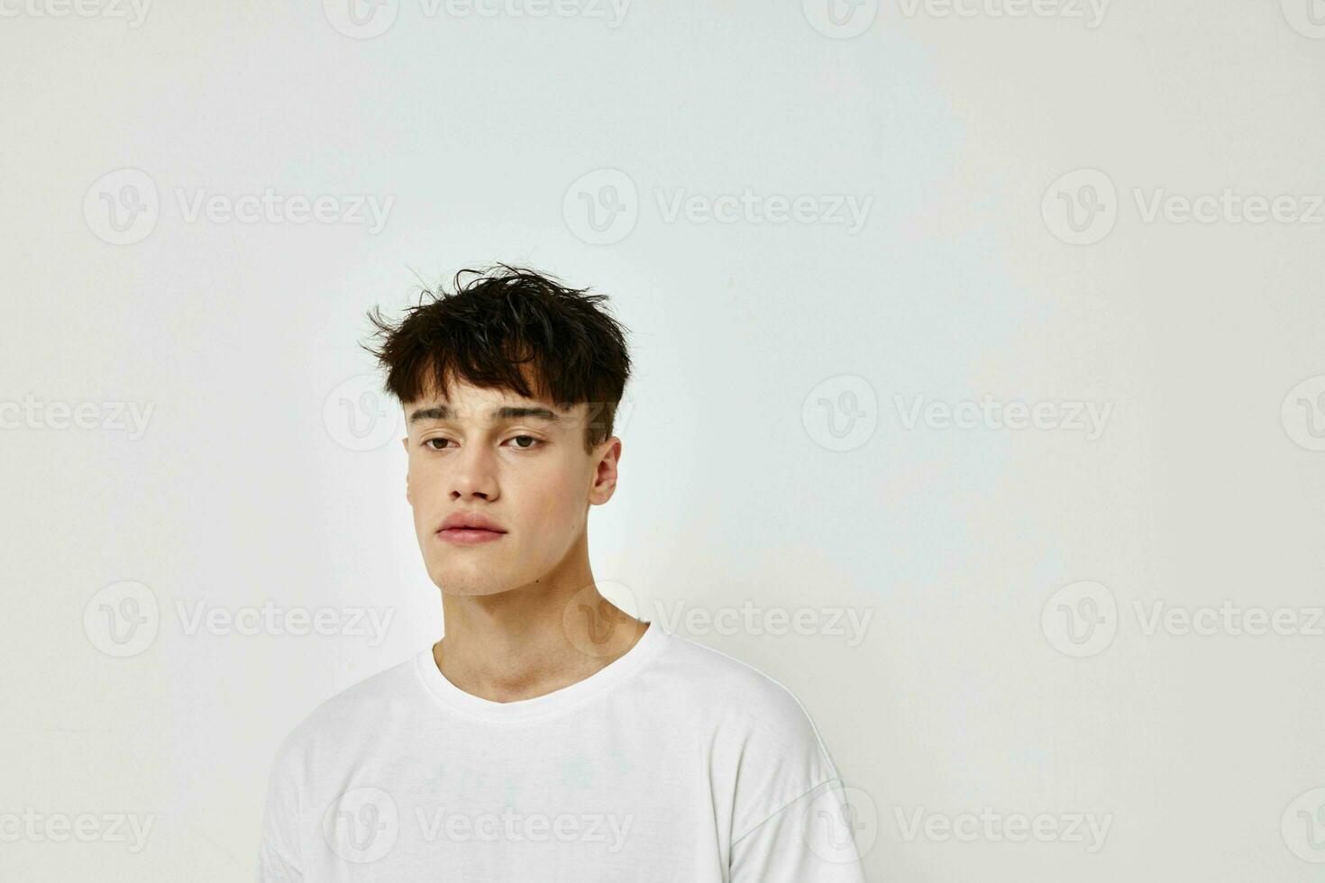 Man tattoo on hands in white t-shirt isolated background unaltered photo