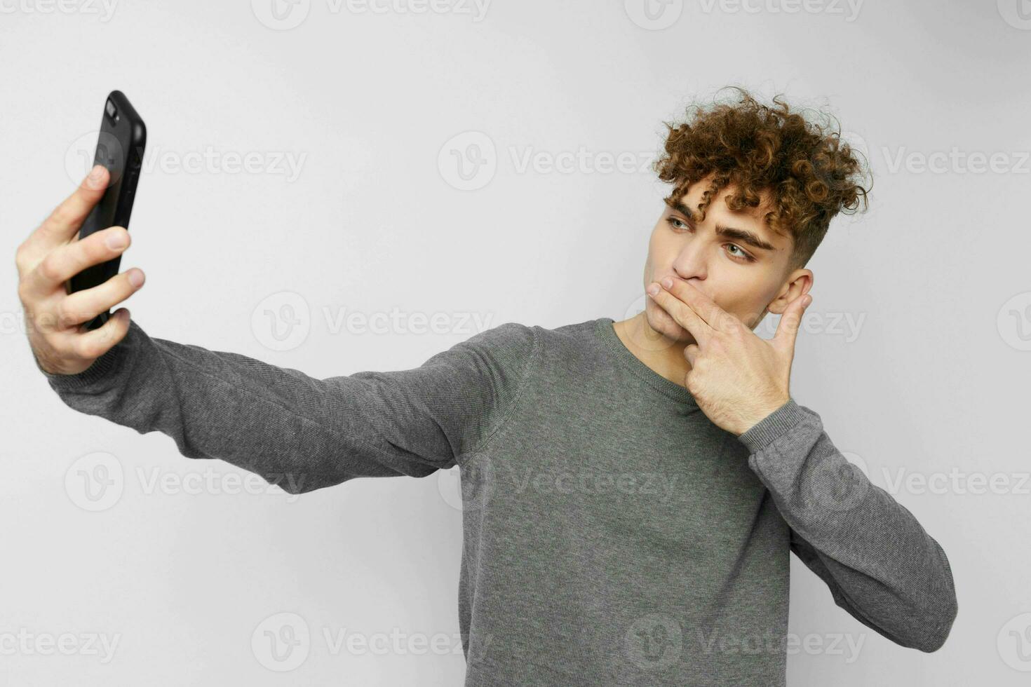 stylish guy looking at the phone fashion isolated background photo