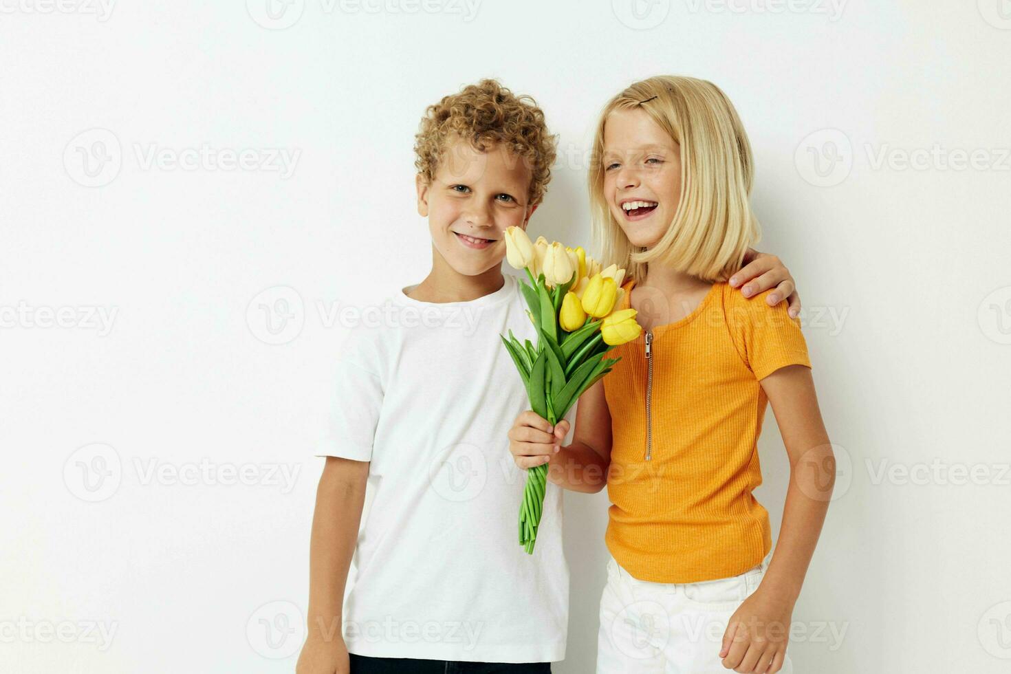 two joyful children fun birthday gift surprise bouquet of flowers isolated background unaltered photo