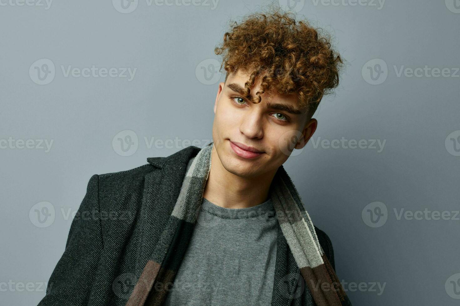 handsome young man elegant style self confidence fashion Gray background photo