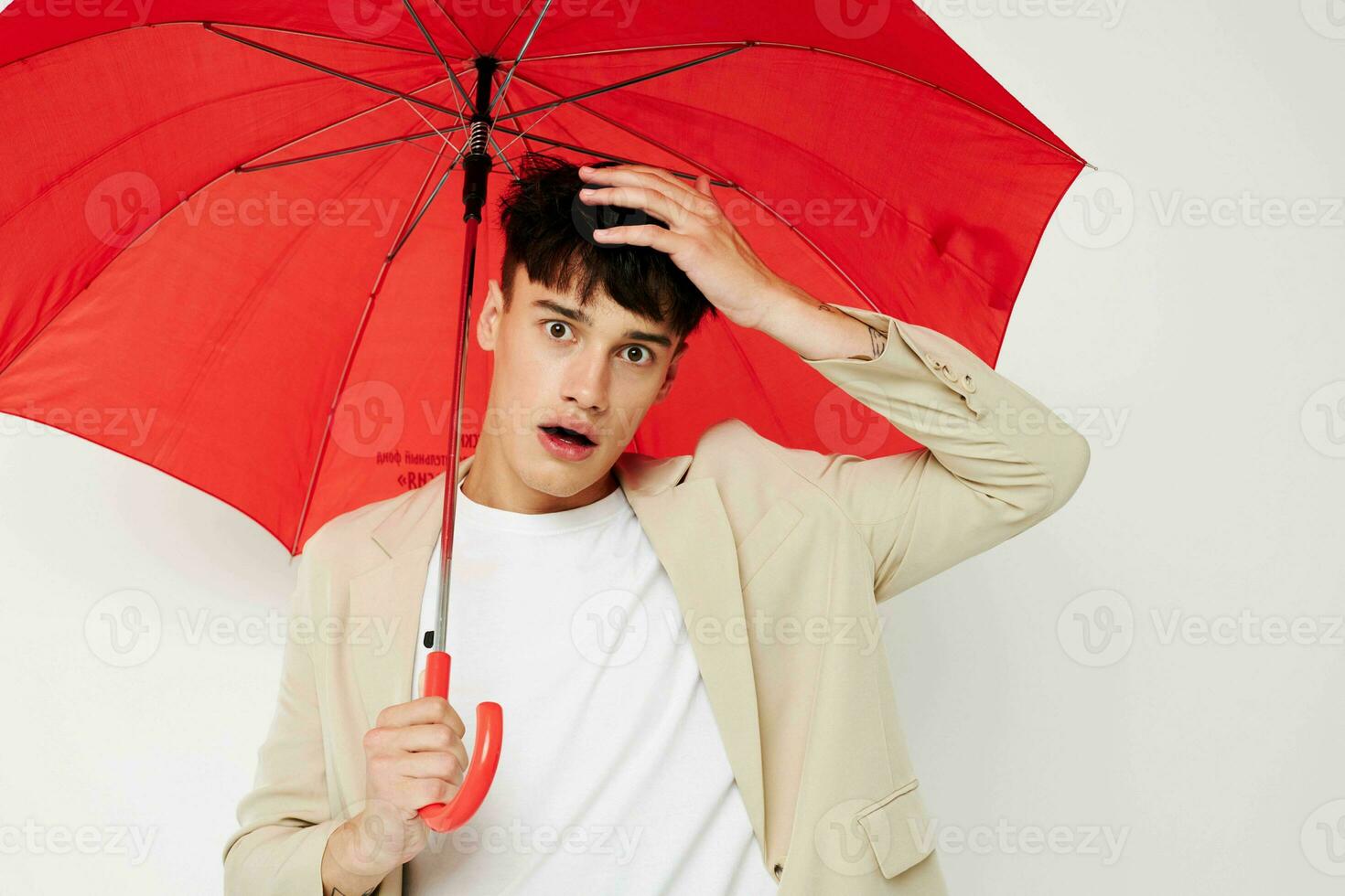 handsome guy rain protection in hand in hand modern style isolated background unaltered photo