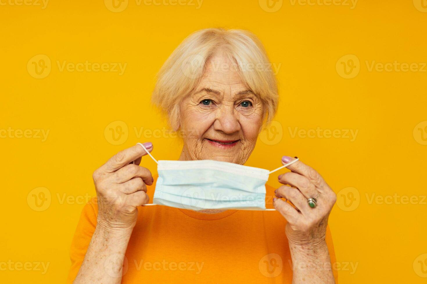 smiling elderly woman posing face grimace joy isolated background photo