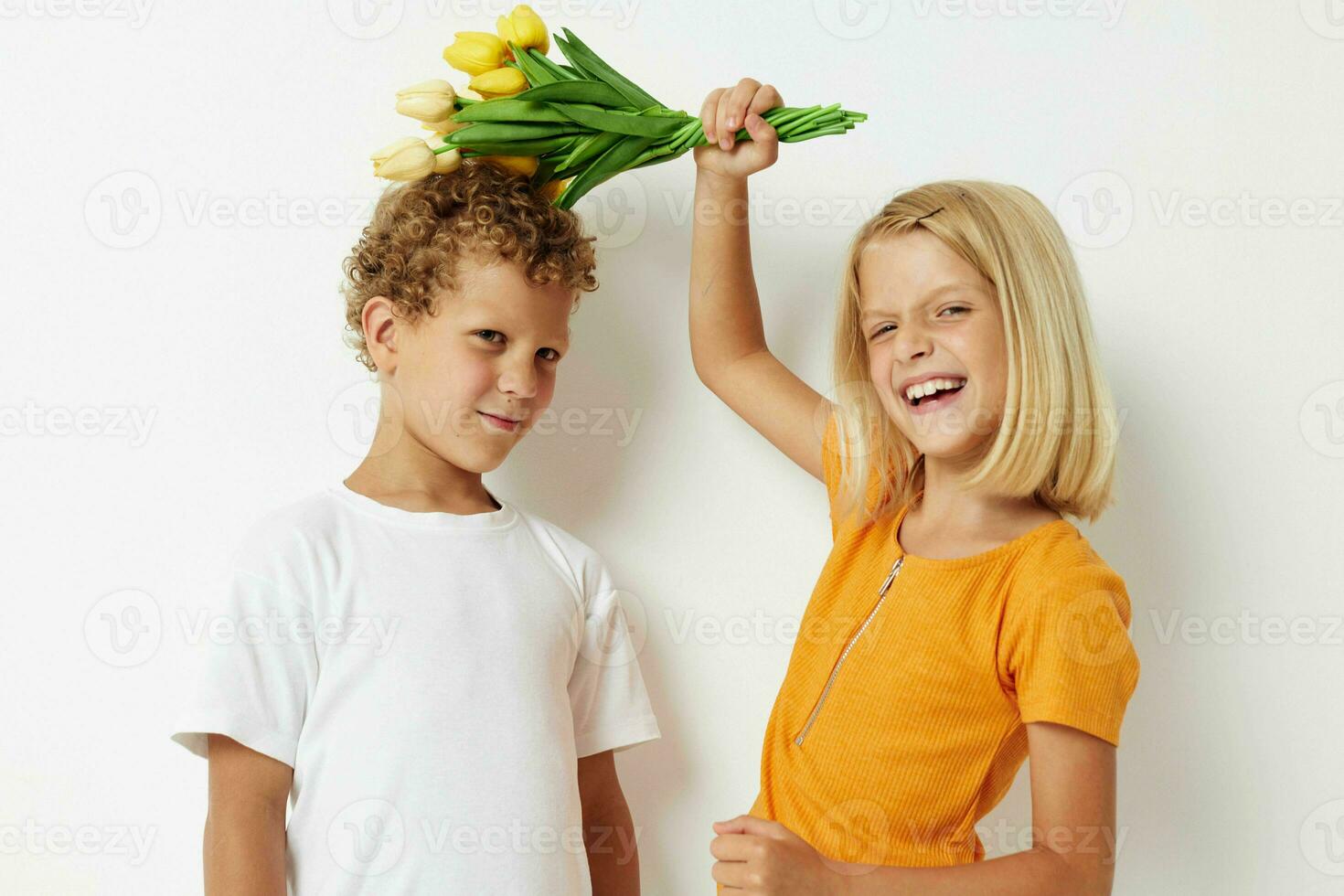 Portrait of cute children holiday friendship with a gift Yellow flowers lifestyle unaltered photo