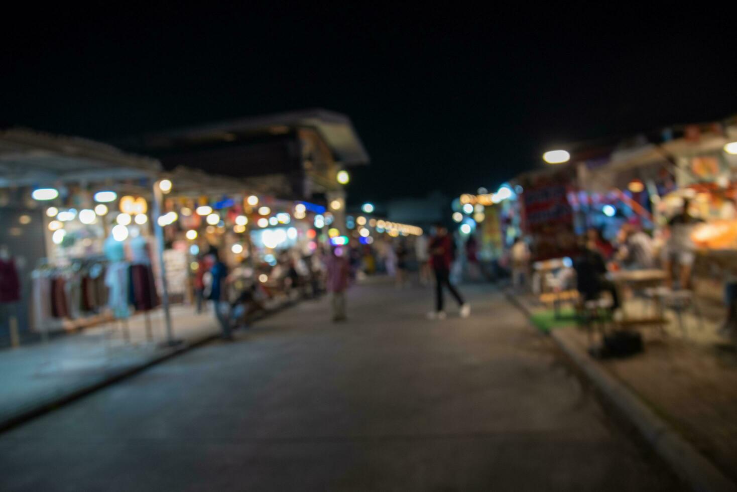 Blur person background food street festival at night market. photo