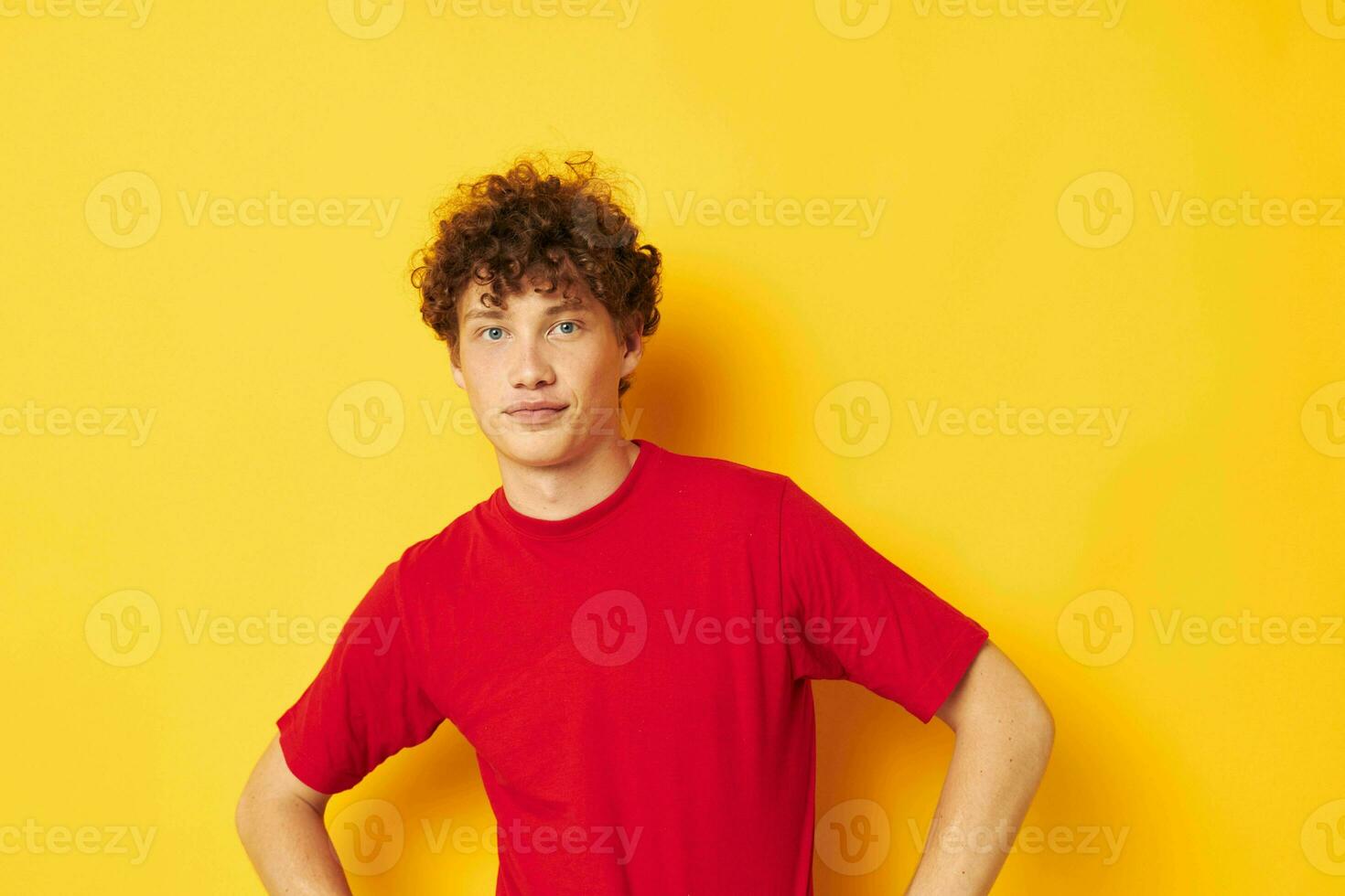 cute red-haired guy red t shirt fun posing casual wear isolated background unaltered photo