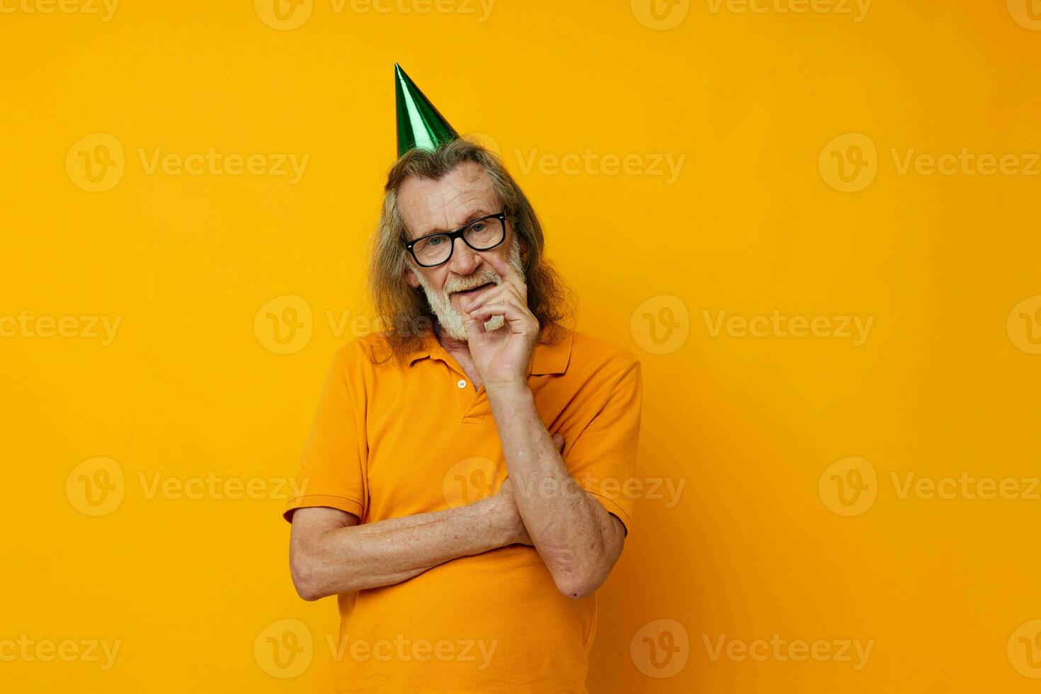 Portrait of happy senior man fun birthday cap on the head monochrome shot photo