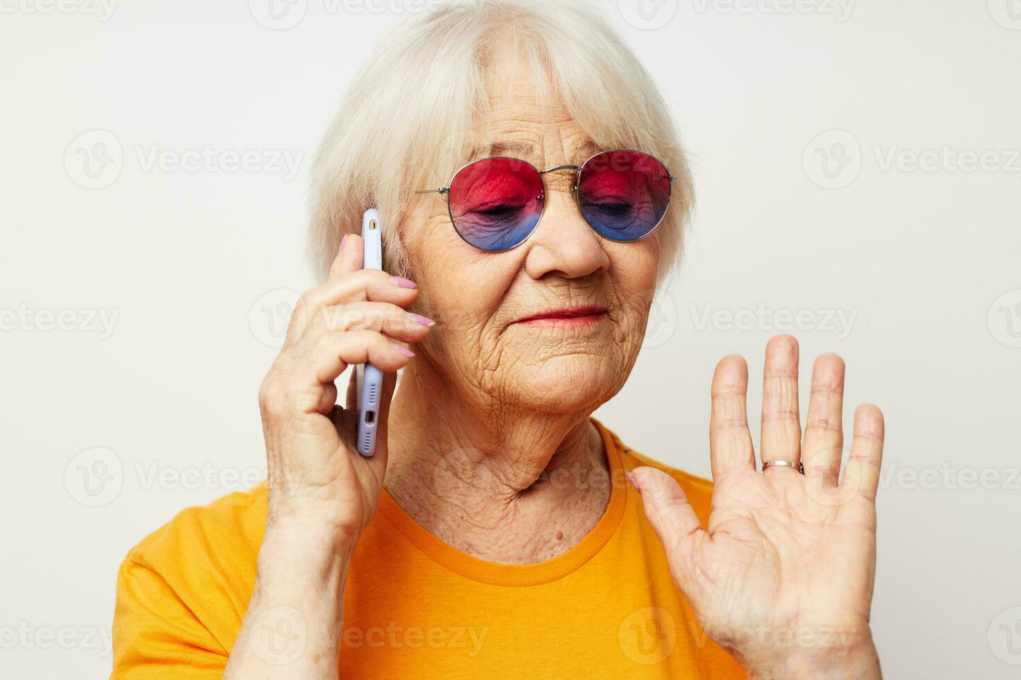 Photo of retired old lady happy lifestyle in yellow t-shirts isolated background