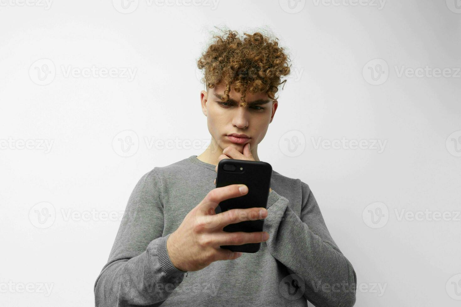 Attractive man looking at the phone fashion isolated background photo