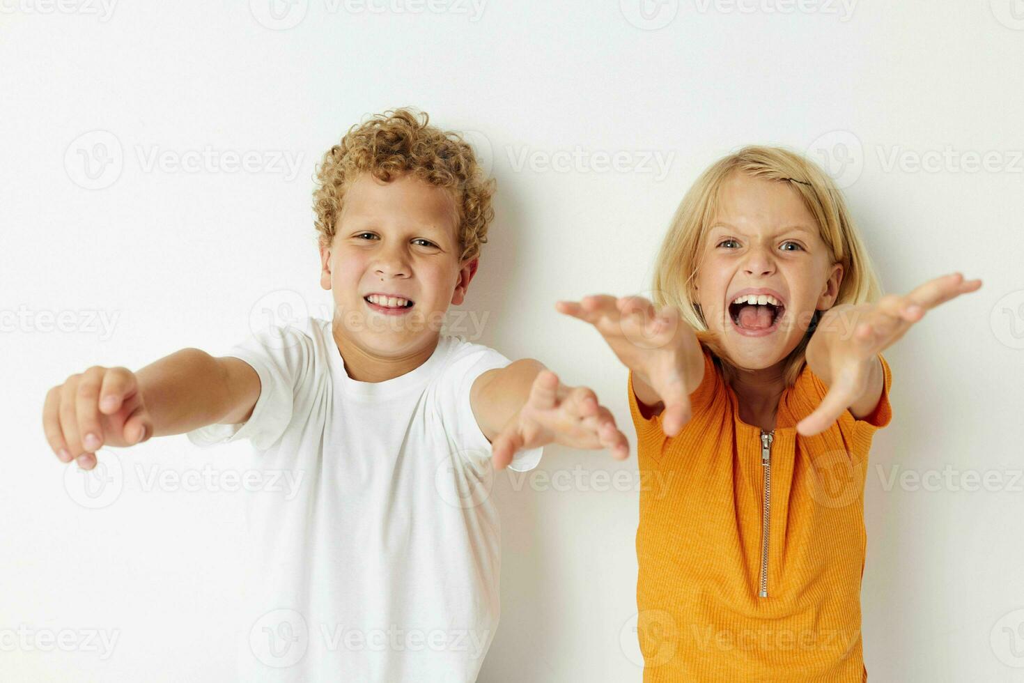 Portrait of cute children hand gestures fun childhood lifestyle unaltered photo