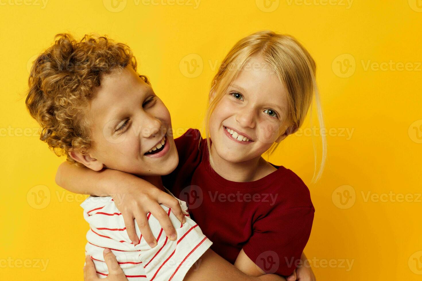 picture of positive boy and girl casual wear games fun together isolated background photo