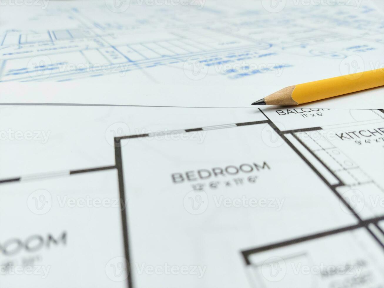 Architectural blueprints and pencil for the project drawings photo