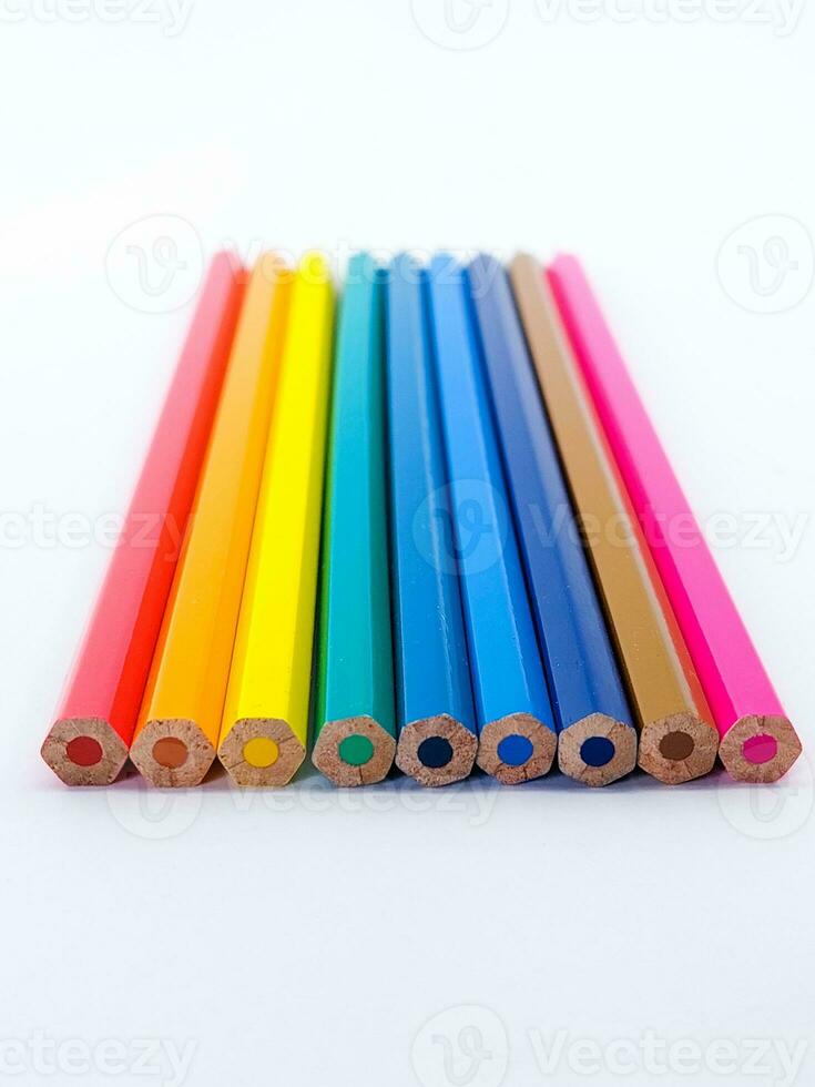 Close-Up Of Colored Pencils On white table photo