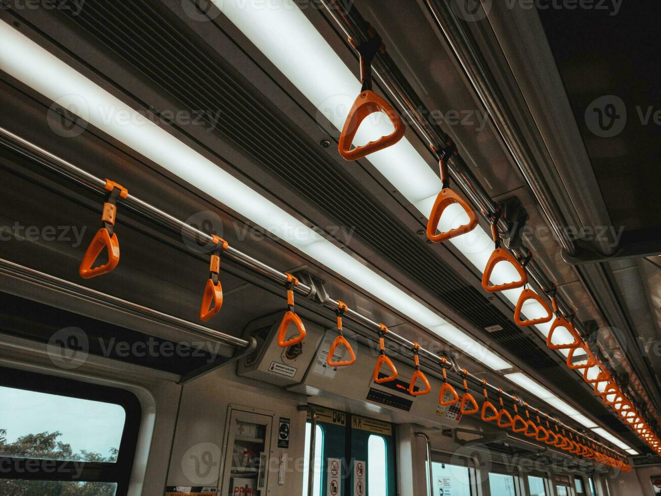 Handles for standing passenger inside public transportation photo