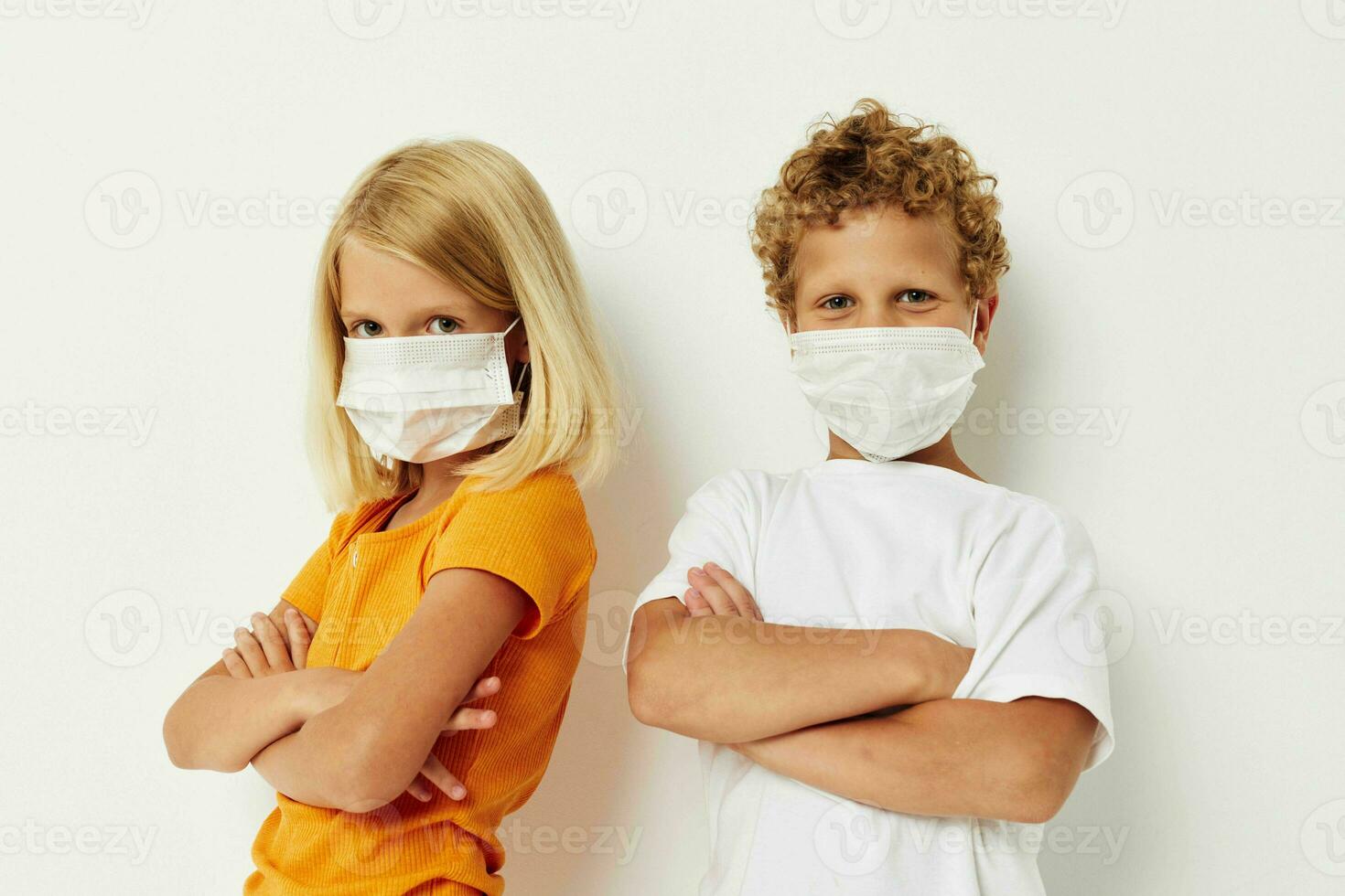 Cute preschool kids in medical mask protection posing grimace isolated background unaltered photo