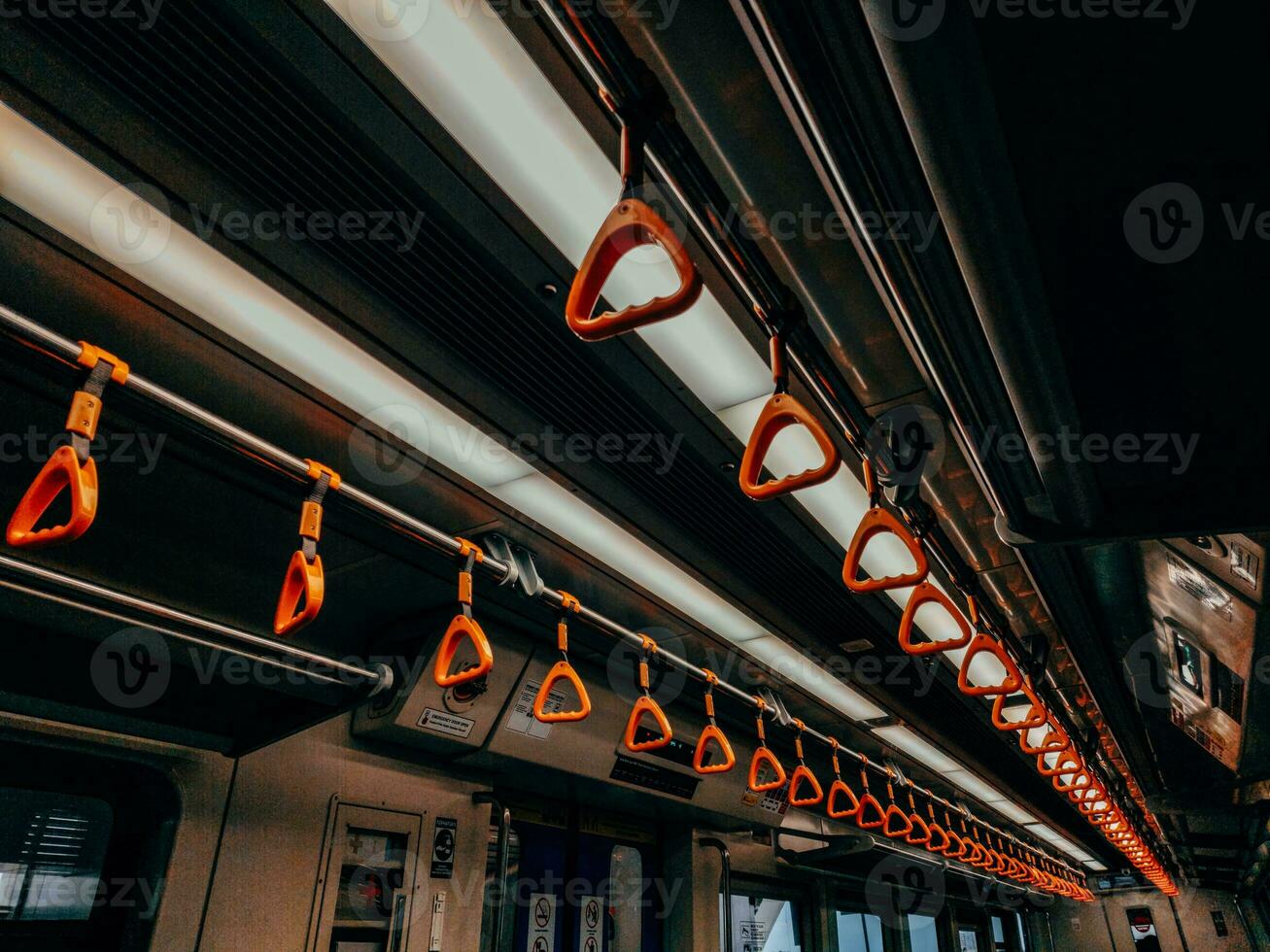 Empty yellow handle grip on public transportation photo