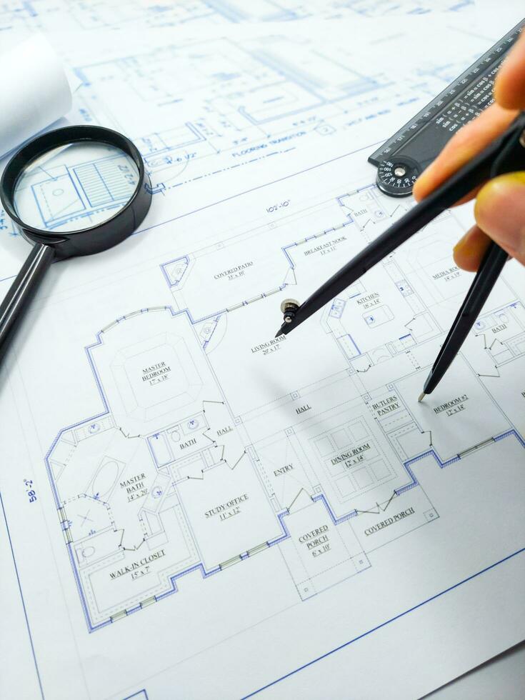 Hands of Engineer working on blueprint. Architecture interior concept. photo