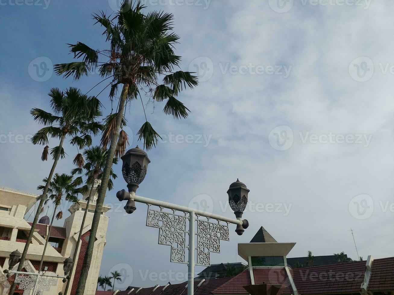 Attin grand mosque under the sunlight and a blue sky in Jakarta, Indonesia photo