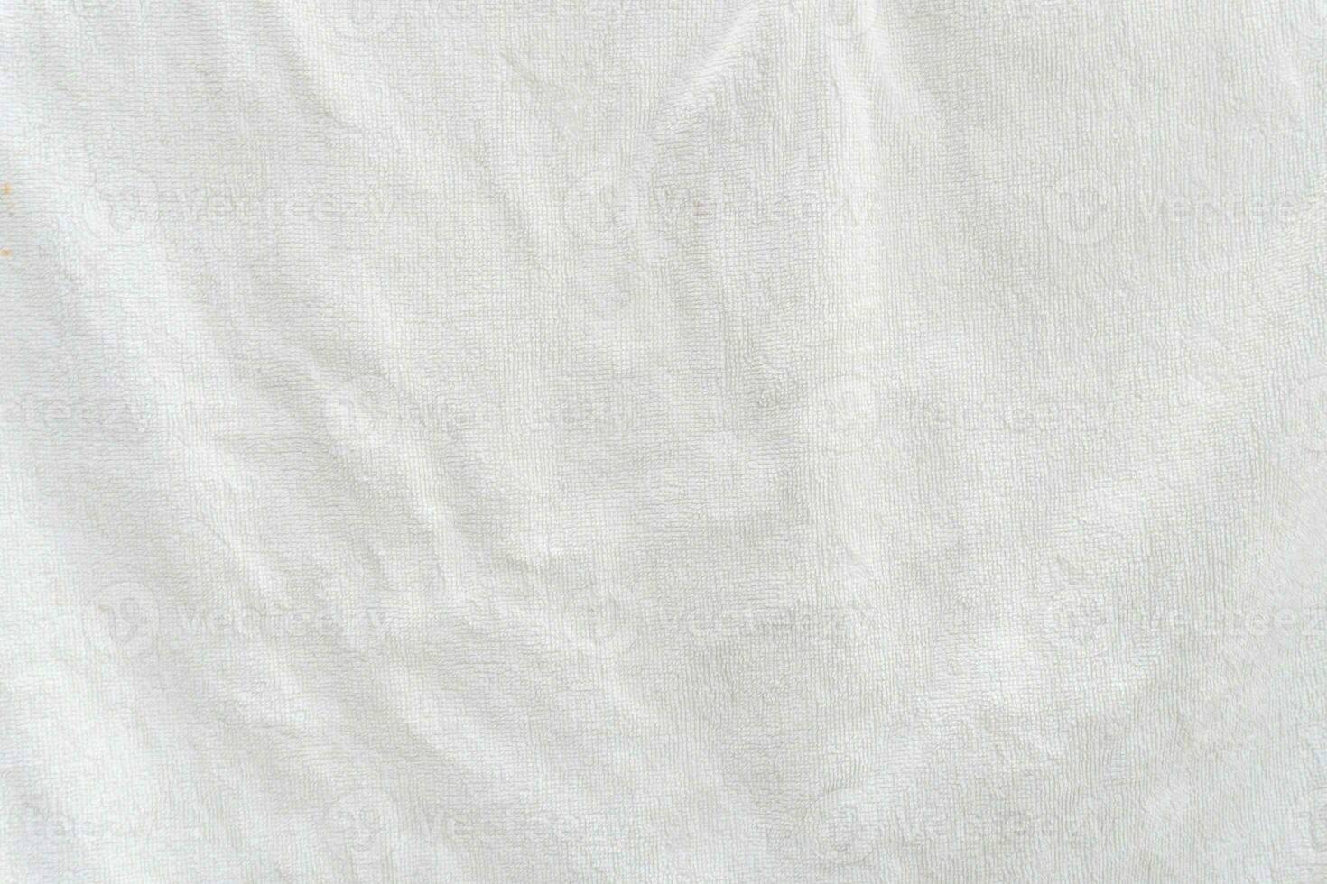 White towel texture background with small wave pattern taken with soft light. photo