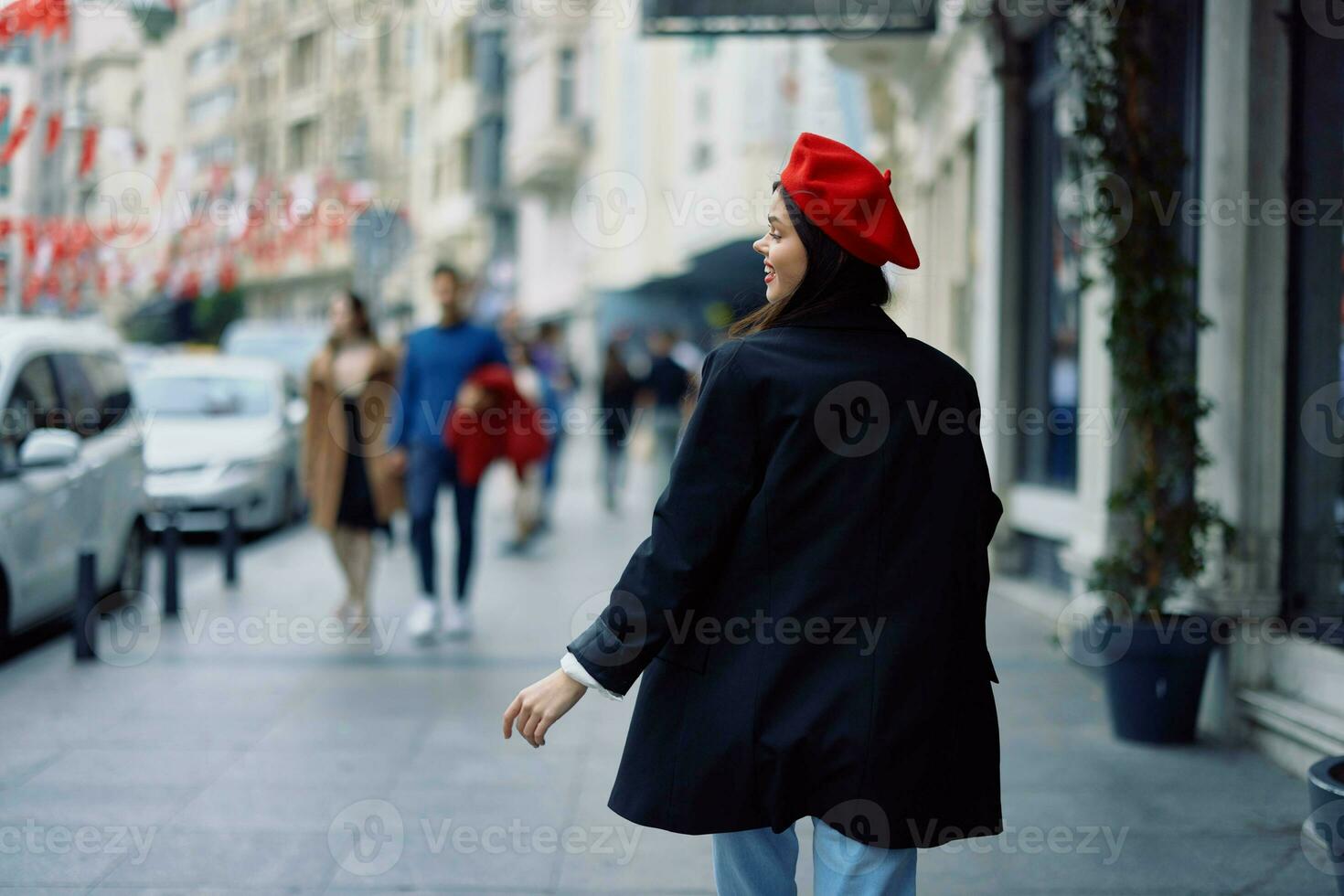 Woman happiness view from the back, follow me walks walks in the city against the backdrop of office buildings, stylish fashionable vintage clothes and makeup, spring walk, travel. photo